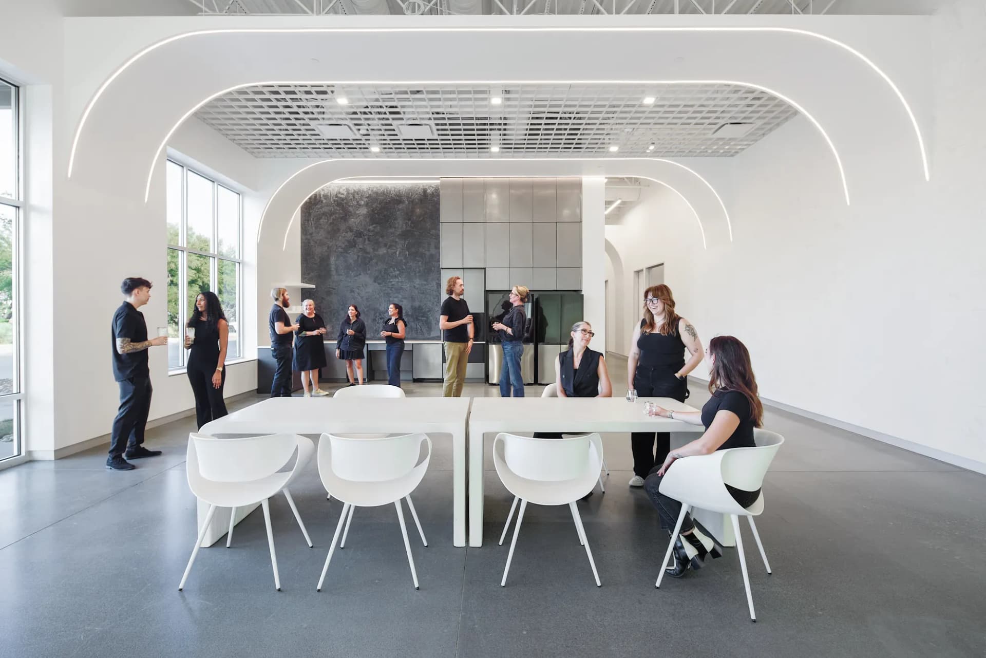 Break room with people gathered around the tables