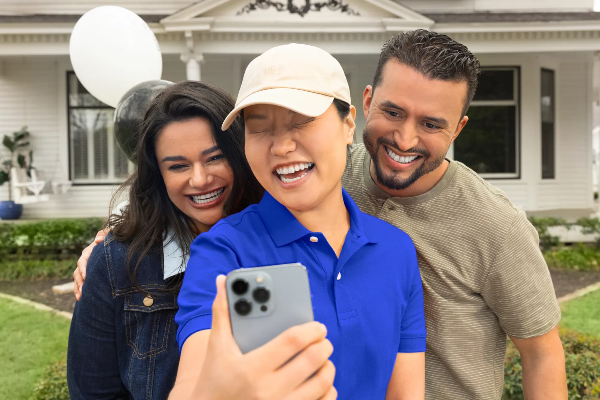 Graduate taking a selfie with her parents