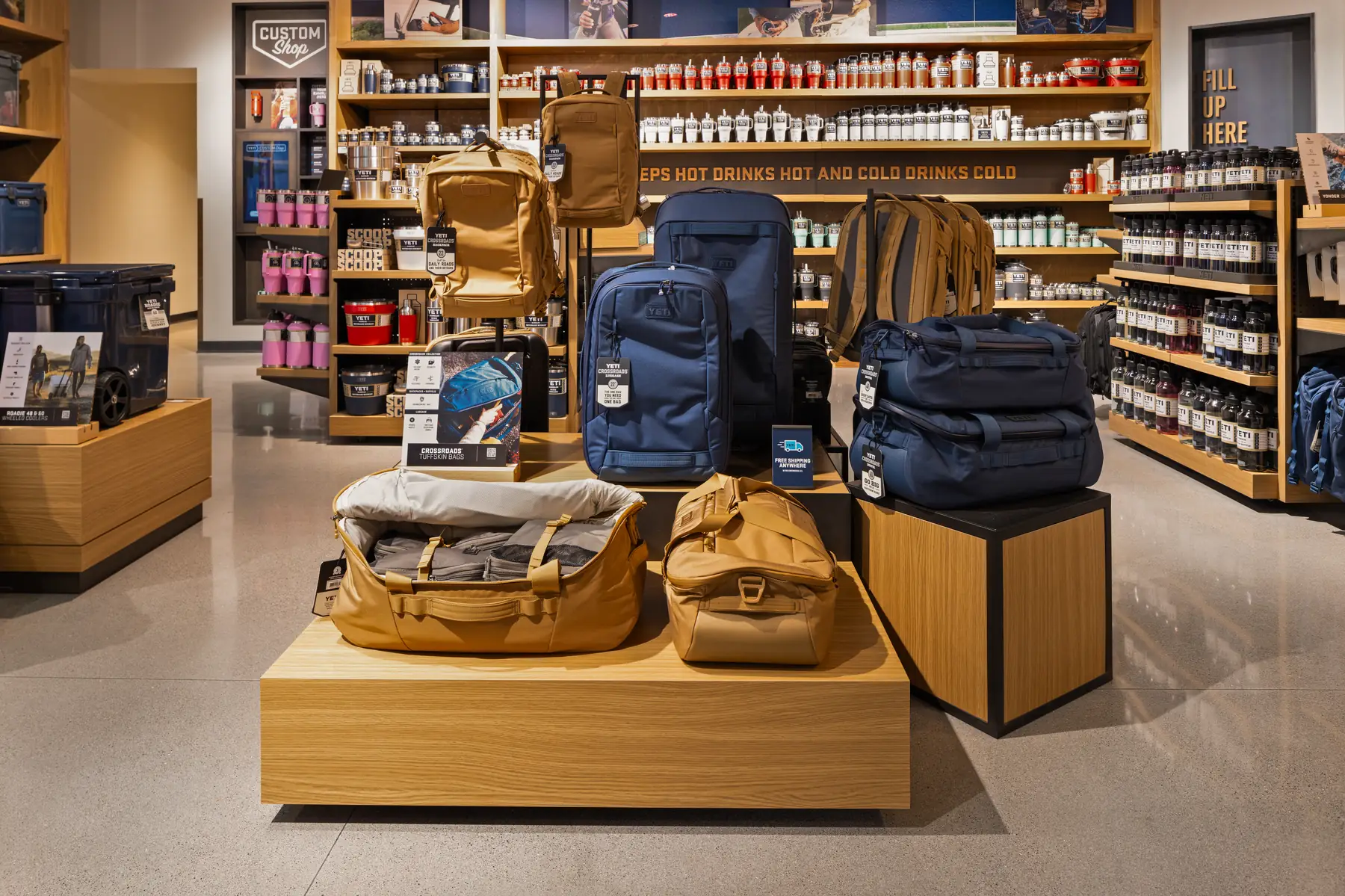 YETI bags and duffels on a center display table