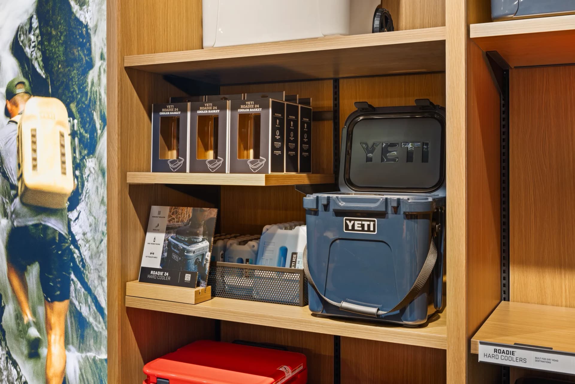 YETI coolers and cases on wood wall shelving