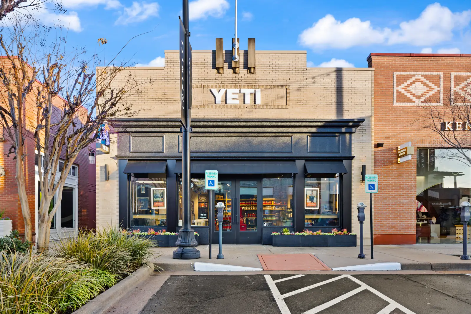 YETI storefront in The Woodlands, Texas, under a clear blue sky