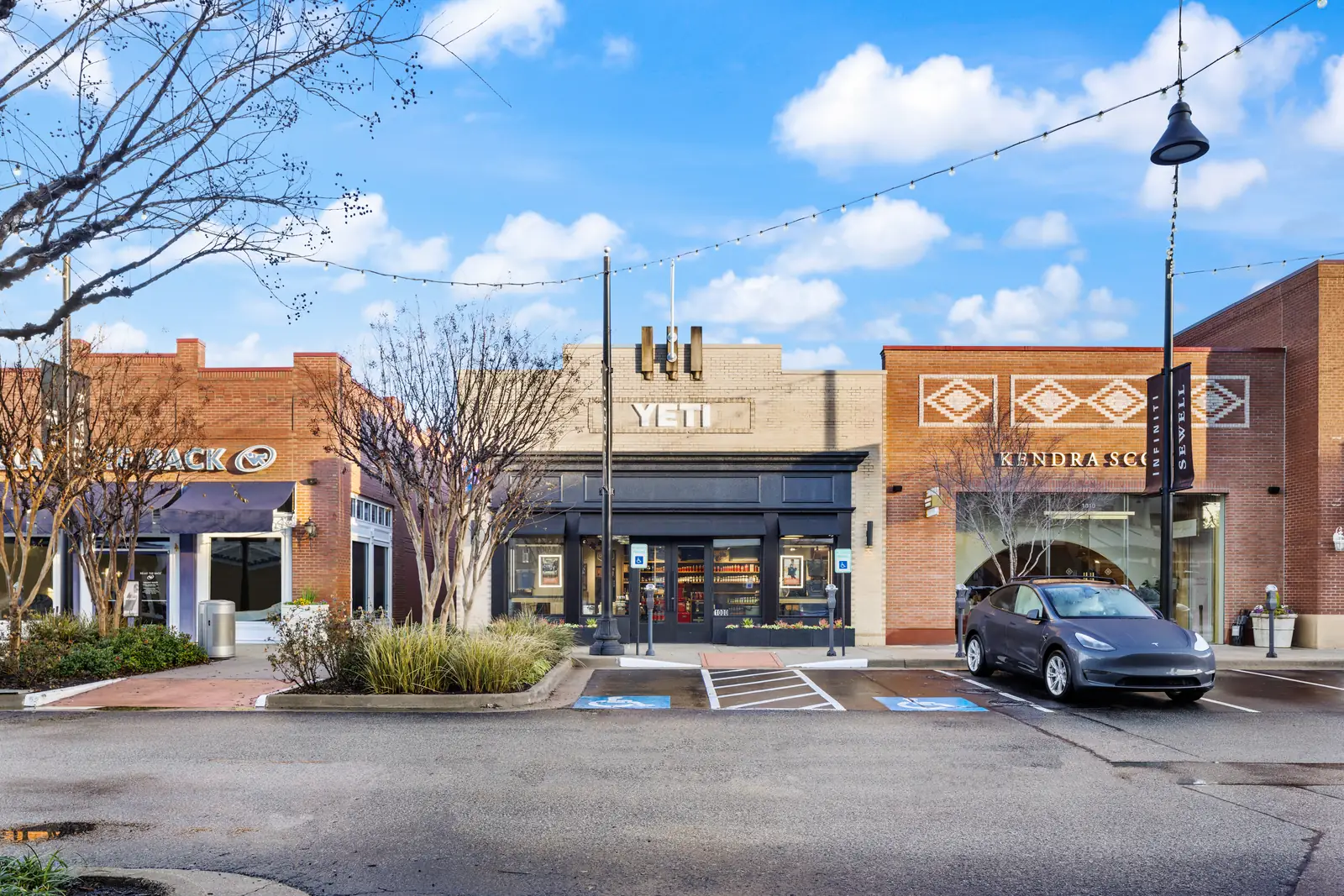 Wide view of the YETI storefront and parking plaza